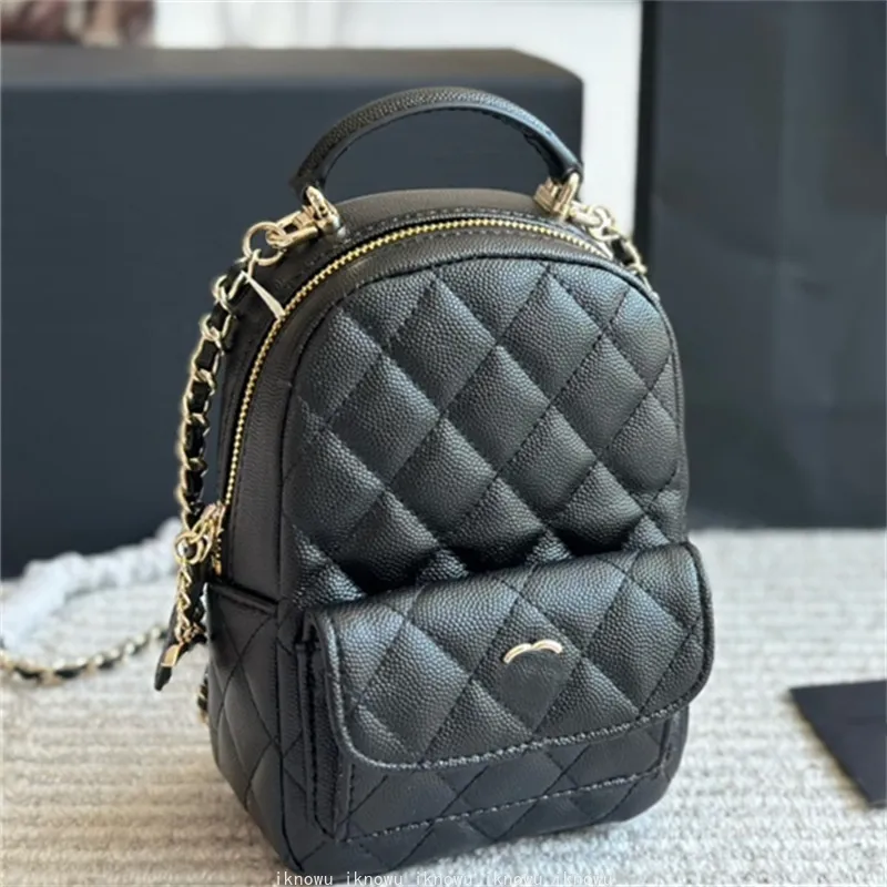 backpacks with the leather diamond Diaper backpack Custom patches Black The chain straps convert to a crossbody so you can carry it two ways Kira Diamond Quilt Small Backpack