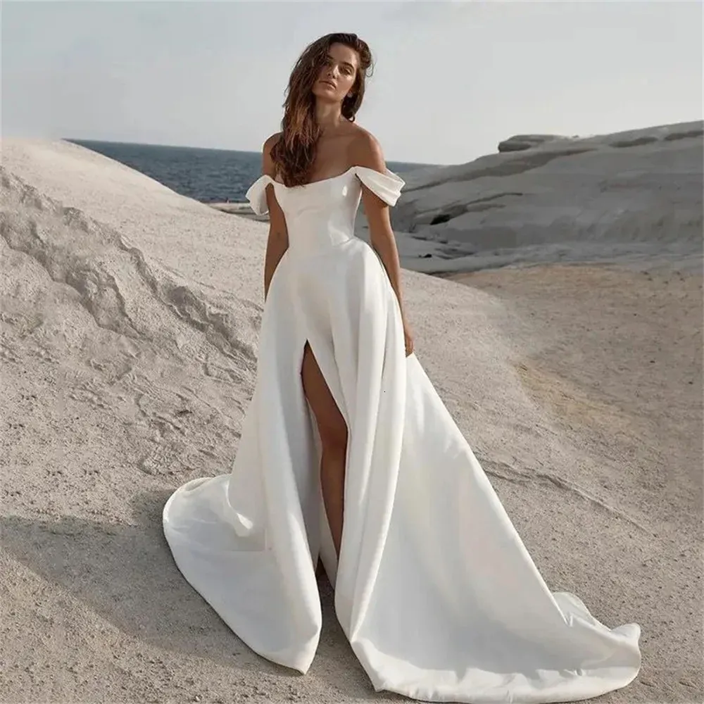 Minimalist Satin wedding dress with slit with Off-Shoulder Design, Sleeveless Side Split, and Side Slots - Perfect for Summer Beach Weddings in 2024 Minimalist Satin wedding dress with slit with Off-Shoulder Design, Sleeveless Side Split, and Side Slots - Perfect for Summer Beach Weddings in 2024