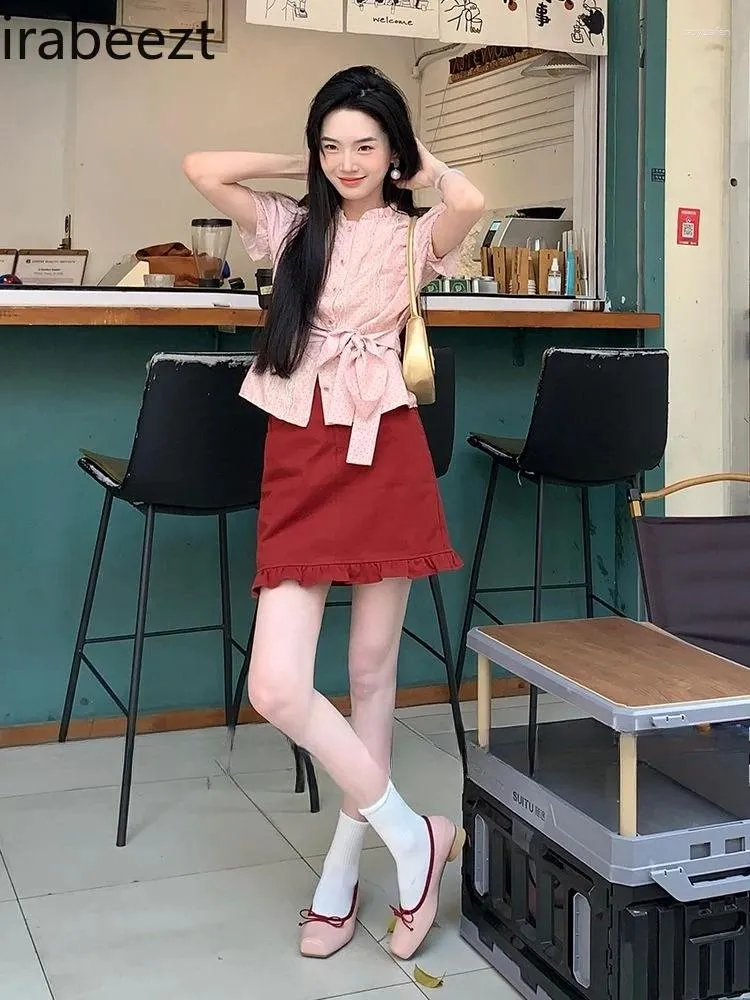 polka dot red blouse and pink skirt outfit