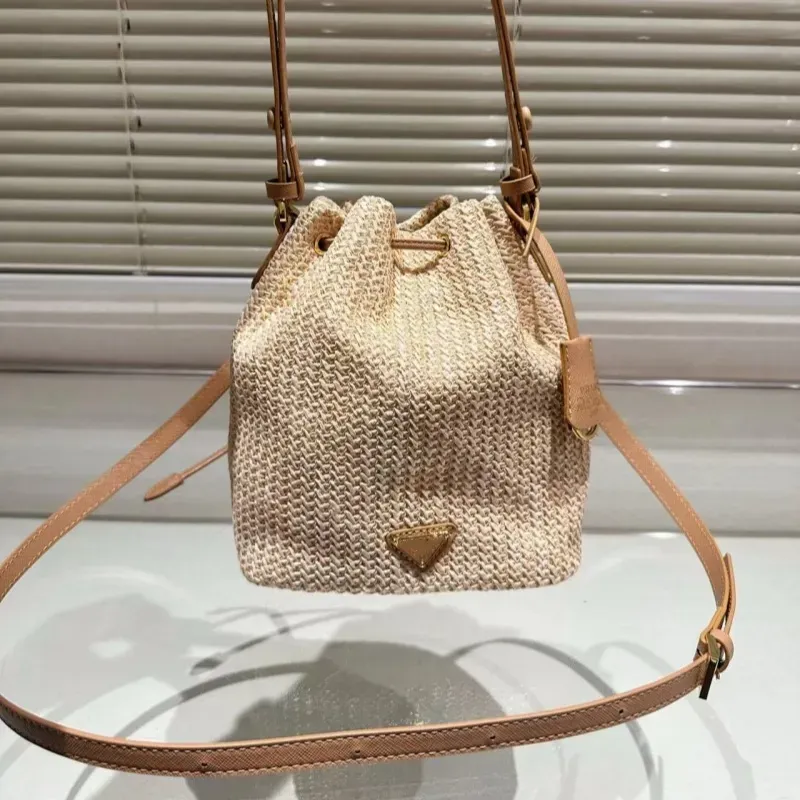 High-end designer bag bucket bag leisure straw woven material leisure sports bag can be carried across the body 