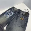 Jeans firmati per pantaloni firmati da uomo pantaloncini da jogging pantaloni della tuta ricamati pantaloni con cerniera lavata con stampa 3D leggings casual 29-38 40