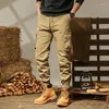 Calças masculinas primavera e outono 2024 emendadas cintura alta elástica multi bolso gravata pés moda cor sólida magro casual trabalho wear