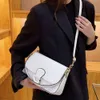 Kleine 2024 Tredy Iteret Celebrity Uderarm Fashioable Dames Hadbag Textuur Wester-stijl Stick Bag Crossbody Tas
