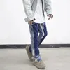 Vintage nödställda stänk av bläck flare jeans herr streetwear lapptäcke hip hop graffiti tung tvätt blå smal fit denim byxor män 240102