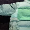 Chaqueta de algodón de invierno cálido impermeable a prueba de viento cuello alto pareja abrigo casual brazalete de diseñador etiqueta de moda cálida abrigo de gama alta