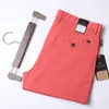 Брюки тонкие летние однотонные костюмные брюки мужские прямые корейский стиль одежда красные оранжевые деловые брюки мужские платья офис 2022