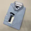 Camisas casuales para hombres Camisa de diseñador Camisa holgada para hombres Camisa de caballero Camisa de negocios de color sólido Tamaño normal Blusa de estilo americano de varios colores T5