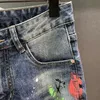 Jeans masculinos finos primavera graffiti rasgado buraco pintura spray remendo hip-hop moda calças jeans masculino streetwear 240102