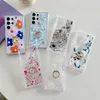 Étuis à fleurs avec anneau en métal pour iPhone 15 14 13 12 11 Samsung S24 A15 A25 A35 A55 A14 S23 Ultra S22 Plus A24 A34 A54 A13 A33 A53 A73 Couverture antichoc florale transparente en TPU souple