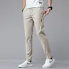 Мужские брюки 2024, повседневные деловые эластичные облегающие брюки для бега с эластичной резинкой на талии, корейские классические синие, черные, серые мужские брендовые брюки