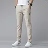 Мужские брюки 2024, повседневные деловые эластичные облегающие брюки для бега с эластичной резинкой на талии, корейские классические синие, черные, серые мужские брендовые брюки