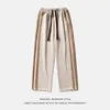 Mäns byxor 2024 Spring mocka kontrasterande färg lapptäcke fashionabla och minimalistisk stil draperad trendig dragkammare avslappnad