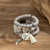 Strand Charm Multi Layered Bangle Set för kvinnor 4st exotiska runda glaspärlor armband bohemiska kvinnliga mode smycken tillbehör