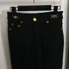 Grundläggande avslappnade klänningar Kvinnor Solid Color Beauty Portrait Gold Button Decoration Slimming Denim Pants With Blad Bottoms