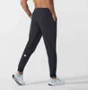 Женские леггинсы Lululemen Брюки Экипировка для йоги Jogger Sport Быстросохнущие спортивные штаны с карманами на шнуровке Спортивные штаны Брюки Мужские повседневные эластичные талии Фитнес-мужчина 14