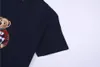 2024 Nouveaux hommes Designer de haute qualité Marque de luxe T-shirt pour hommes T-shirt pour femmes Casual chemise à manches courtes en vrac Vêtements pour hommes et femmes S-2XL a1