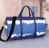 Luksurys projektanci 50 cm dla kobiet torebki podróżne torebki torebki menu menu na ramię noszenie bagażu dna nity pojemność torba sportowa