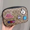 Cooach Bag Kou Family Emblem New Styleワンショルダークロスボディバッグファッション汎用性のある女性用バッグオリジナル画像顧客サービスを探して