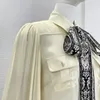 Женский комплект из двух предметов: бежевая повседневная блузка с длинными рукавами-фонариками и шарфом в стиле ретро, широкие брюки, черный женский комплект с поясом