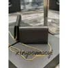 2024 Sacs de soirée Sac enveloppe Sac à bandoulière de luxe Designer Mini Sac à bandoulière en cuir de veau Beige Sacs à bandoulière Qiuaiity UPTOWN CHAIN WALLET HAYBRICK