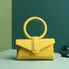 Bolsa de cintura Envelope Primavera / Verão Internet celebridade Yuko Xiaojing Mesmo anel Bolsa de cor doce Ombro único Cruz diagonal branco amarelo