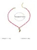 Collier de perles rouges à la mode, pendentif béquille, cadeau de noël, cloches colorées, bijoux de fête tendance, vacances, 2024