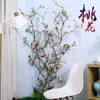 Dekoratif çiçekler yapay şeftali çiçeği branch vines arka plan duvar süslemeleri kiraz ağaçları pastoral ip ev dekorasyon
