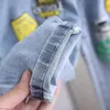 Pantaloni jeans per bambini Pantaloni primaverili e autunnali Pantaloni elasticizzati per ragazzi 2023 Piedi stampati larghi per bambini 240103