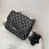 24c stjärnor väska stilfulla kvinnor ryggsäck 23 cm glänsande patent läder diamant gingham guld hårdvara metallisk lås lyxhandväska matelasse kedja crossbody väska makeup väska