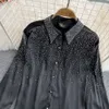 Damesblouse met ronde kraag, glanzende bling en strasssteentjes, lange mouwen