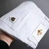 7 stylów Białe szczupły dżinsy Zaawansowane rozciąganie chude hafty dekoracyjne dżinsowe spodnie męskie ubrania marki 240104