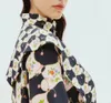 Australisk designerklänning svart siden långärmad stativ krage falsk sjal blommig tryck skjorta miniklänning