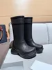 Bottes longues de styliste pour femmes, bottes de luxe classiques à tête ronde, bottes de luxe en caoutchouc, chaussures de pluie à tambour haut, bottes à semelle épaisse