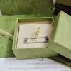 Anelli di design di lusso per donna uomo anello con diamanti moda fiore cavo anello in oro trendy coppia anelli regalo di festa premium di alta qualità Quvvj