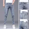 2023 Spring och Autumn Fashion Solid Color Holes Small Feet Pants Men Casual Slim bekväm elastisk högkvalitet Jeans 36 240104