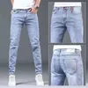 2023 Spring och Autumn Fashion Solid Color Holes Small Feet Pants Men Casual Slim bekväm elastisk högkvalitet Jeans 36 240104