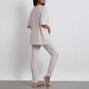 Mulheres sleepwear sólido casa 2pcs pijamas mulheres cor com nervuras malha manga curta tripulação pescoço tops com calças de cintura elástica loungewear