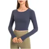 Nouvelle tenue de yoga élastique Fit T-shirt à manches longues pour la mode T-shirts blancs Vêtements pour femmes Sports de plein air Fitness Sweat-shirt de printemps pour femmes