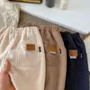 Pantaloni sportivi casual larghi della molla della ragazza del neonato Moda stile coreano Pantaloni di velluto a coste solidi Autunno Bambini Pantaloni da jogging Pantaloni sportivi 240106