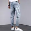 Jeans masculinos desgastados borla rasgado para homem baixo bolsos de cintura magro calças jeans início outono caber casual mens designer roupas