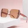 10% de réduction sur la vente en gros de lunettes de soleil résistantes aux UV, sans cadre à la mode pour femmes, lunettes de soleil à la mode