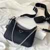 Luxurys handväska kvinnor re edition nylon axelväska crossbody designer väska man koppling triangel messenger väska 3 styck mode restmode halvmåne månväska