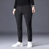 Pantaloni in pile da uomo caldi invernali spessi business stretch slim fit elastico in vita jogger coreano classico nero grigio blu pantaloni uomo 240106