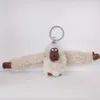 Porte-clés mignon peluche fourrure singe porte-clés orang-outan pantalon femmes sac voiture bibelot femme bijoux fête poupée porte-clés 10 15 cm