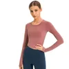 Nouvelle tenue de yoga élastique Fit T-shirt à manches longues pour la mode T-shirts blancs Vêtements pour femmes Sports de plein air Fitness Sweat-shirt de printemps pour femmes