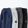 Pantaloni da uomo Uomo con coulisse alla caviglia Elastico a vita media Spessore caldo Patchwork Cavallo profondo Tasche larghe tinta unita Pantaloni sportivi