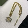 Designer halsband kvinna hängsmycken rostfritt stål halsband kristall g brev smycken mode för designers lång tröja kedja