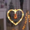 クリスマスレザーの弦楽吸引カップライト、クリスマスシーンのアレンジメントを飾り、美化し、クリスマスライトを飾る、窓のアレンジメント