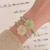 チャームブレスレットオリジナル中国の花織りブローテットニッチエスニックスタイルセラミックキャリングストラップアクセサリーを調整可能