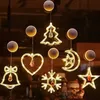 クリスマスレザーの弦楽吸引カップライト、クリスマスシーンのアレンジメントを飾り、美化し、クリスマスライトを飾る、窓のアレンジメント